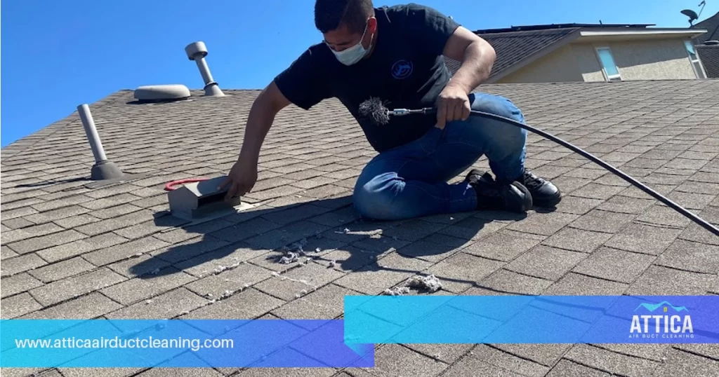 An image shows a technician from Attica performing dryer vent cleaning services.