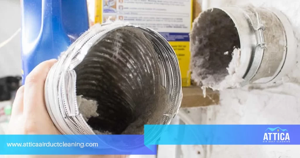 Image in which a technician is showing how to clean the filters on your machine to maintain dryer efficiency. 