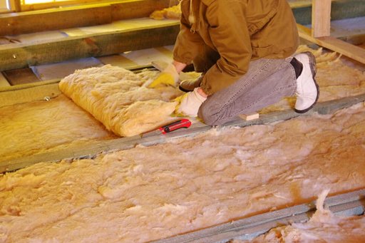 An image shows a technician from Attica providing insulation removal services. 